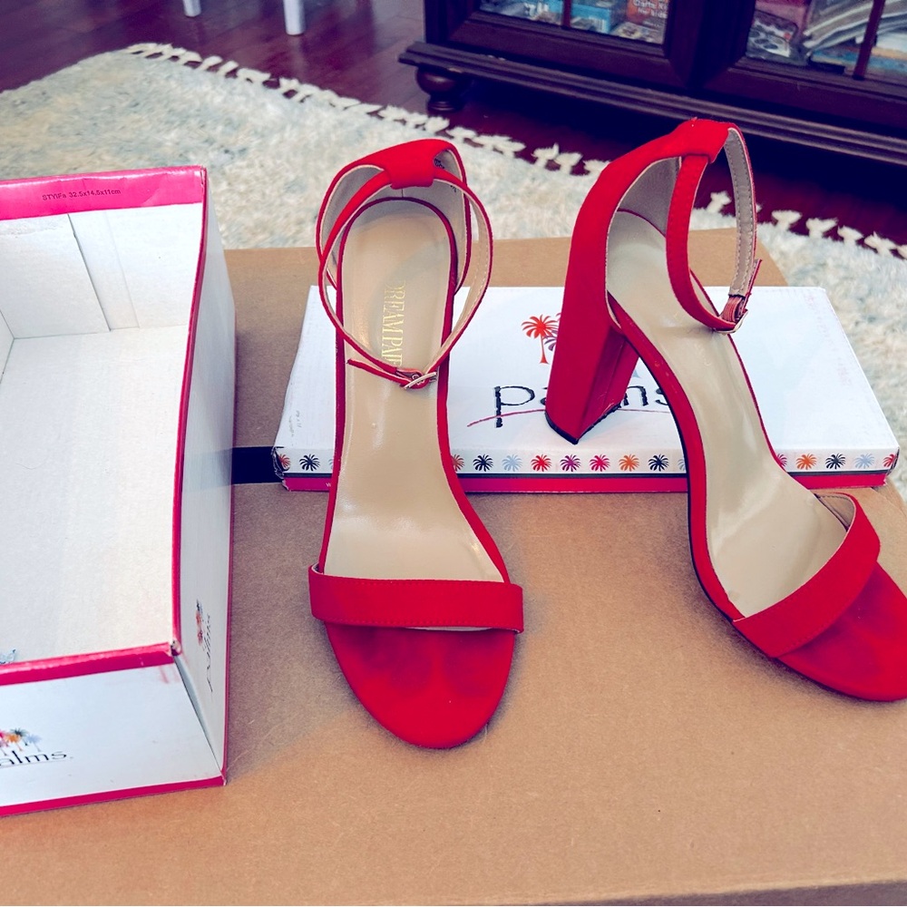 Ladies Red swade, high chunky heels, with ankle strap. Size 10 wore once to prom